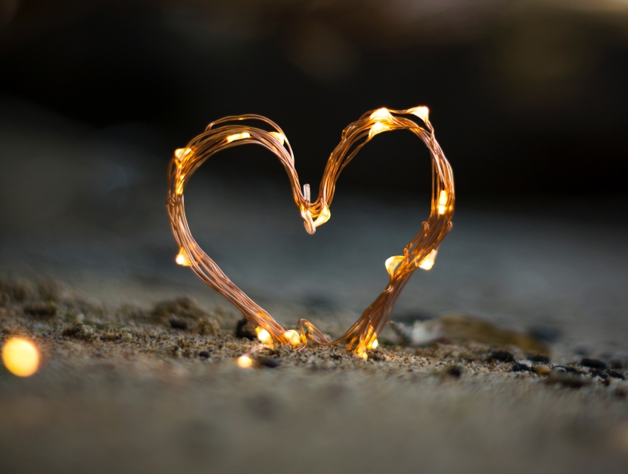 Wire heart in sand. Friendships end, but let's avoid that and keep friends close. 